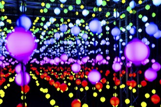 Light, glowing balls, LED lamps, hang in series, side by side, on top of each other, change their