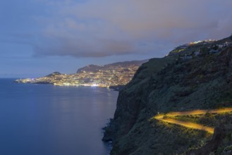 View of the Atlantic Ocean from Christo Rei viewpoint at dusk, harbour with cruise ships and