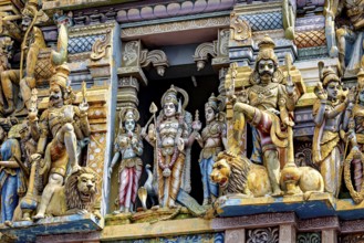 Artfully decorated sculptures of deities and lions at a temple