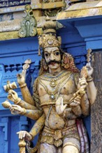 Detailed and colorful sculpture of a deity at a temple