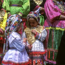 Kanakaries (girl) with gold jewellery made of gold coins, Easter Tuesday (Lambri Tritti), Olymbos,