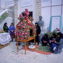 Good Friday, woman decorate the epitaph, Olymbos mountain village, Olymbos, Karpathos, Dodecanese