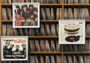 Records by Pink Floyd, the Rattels and the Rolling Stones with more records on the shelf, former