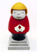 An avenger figure from the Ore Mountains depicts former federal chancellor Angela Merkel in black