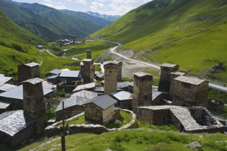 Historic village with many towers, located in a green mountain valley, defensive towers, Ushguli,