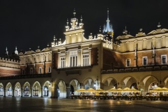 Night view of Rynek with Cloth Hall, from 13th century, Main Market Square, city landmark, Krakow,