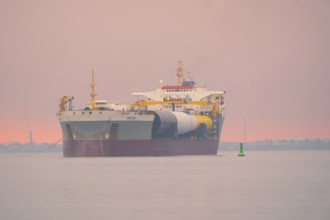 A semi-submersible ship is towed from the Weser to the North Sea, Bremerhaven, Bremen, Germany