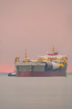 A semi-submersible ship is towed from the Weser to the North Sea, Bremerhaven, Bremen, Germany
