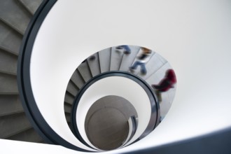 Spiral staircase with descending persons, Bavaria, Germany