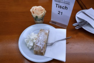 Apple strudel served with cream in a café, Nuremberg, Middle Franconia, Bavaria, Germany