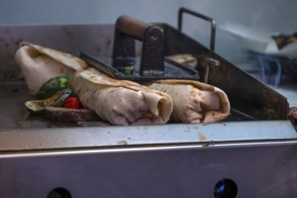 Finished falafel on a hot plate, in a falafel stand in the pedestrian zone, Nuremberg, Middle