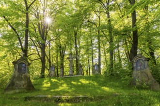 Old Way of the Cross with various stations and group of figures of Christ on the Cross at the top