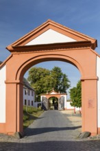 View through 2 gates at the entrance to St. Marienthal Abbey on the Neisse, Ostritz, Saxony,