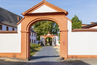 View through 2 gates at the entrance to St. Marienthal Abbey on the Neisse, Ostritz, Saxony,