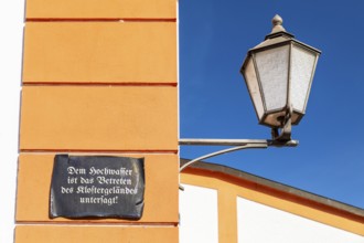 Lantern and façade with sign, Floods are prohibited from entering the monastery grounds, St.