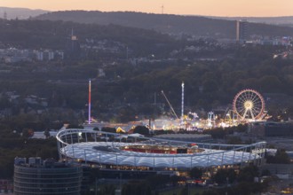 29 Sep 2018 at dusk, Volksfest lights seen from Rotenberg chapel with stadium foreground and