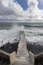 Pier during storm, bridge with waves, Atlantic Ocean, Madeira, Portugal