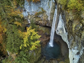 Aerial view of Berglistüber waterfall in autumn-colored surroundings, Linthal, Klausenpass, Canton