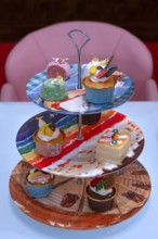Artificial cupcakes on a cake stand, England, Great Britain