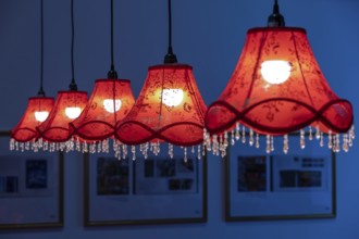 Five glowing hanging lamps, England, Great Britain