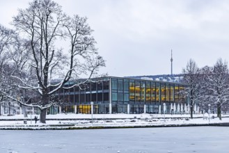 Exterior view of the state parliament building with Eckensee and television tower. Winter in