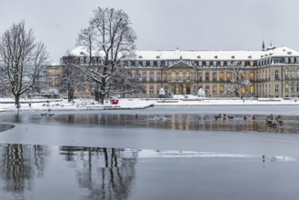 New castle with Eckensee. Winter in Stuttgart. The city is wintry white early in the morning.
