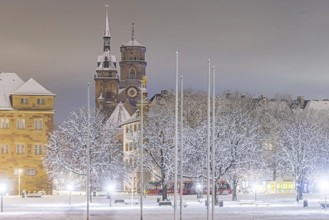 Winter in Stuttgart. The city is wintry white early in the morning. Castle square with collegiate