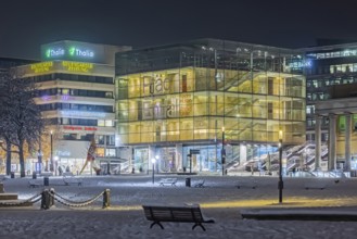 Winter in Stuttgart. The city is wintry white early in the morning. Palace Square with art museum.