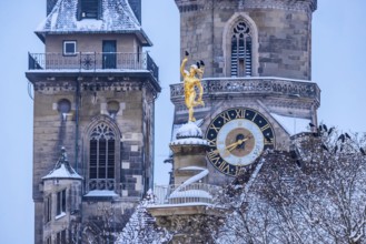 Winter in Stuttgart. The city is wintry white early in the morning. Collegiate church with