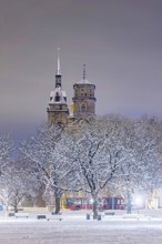 Winter in Stuttgart. The city is wintry white early in the morning. Castle square with collegiate