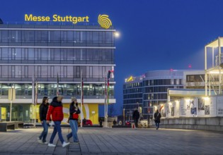 Messe Stuttgart in the evening. Administration building with illuminated logo. Stuttgart,