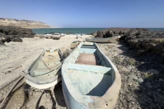 Old fishing boats, fishing village with boats on the beach, near Ras Madrakah, Oman