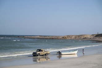Car pulls fishing boat into sea, Oman