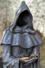 Monk sculpture, one of three bronze statues of faceless monks at the Danish King's Garden in the