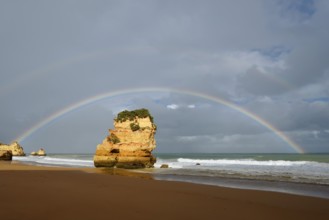 Rocks on beach with rainbow, Praia Dona Ana, Lagos, Algarve, Portugal