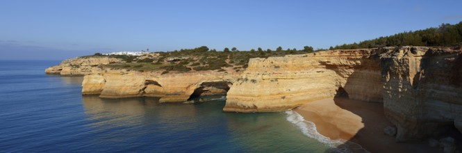 Rocky coast with caves, Praia da Corredoura, Algarve, Portugal