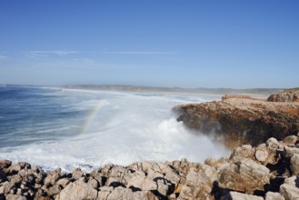 Surf with rainbow on the rocky coast, Carrapateira, Parque Natural do Sudoeste Alentejano e Costa
