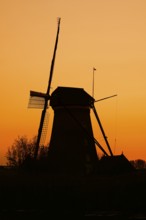 Historic windmill at sunset, UNESCO World Heritage Site, Kinderdijk, South Holland, Netherlands