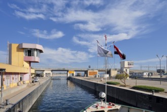 Nile cruise ship enters the lock at the Esna dam, Esna, Egypt