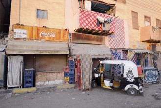 Shops and tuk-tuk, Esna, Egypt