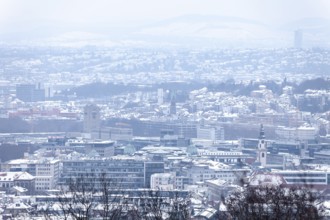 March 18, 2018, winter view with snow toward city center with station and tower from Mount