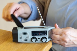 Radio with crank mode, by turning the crank we generate electricity in a dynamo, which charges a