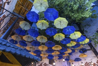 Umbrellas as decoration in a courtyard of a restaurant, Czernowicz, Ukraine