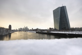 Snow lies along the banks of the Main from the European Central Bank (ECB) to the Frankfurt banking