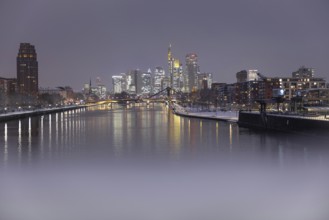 There is snow on the banks of the Main from the Wesel shipyard to the Frankfurt banking skyline,