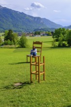 Bank, optical illusion at Café Pauli, Aschau, Chiemgau, Upper Bavaria, Bavaria, Germany