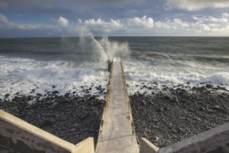 Pier during storm, bridge with waves, Atlantic Ocean, Madeira, Portugal