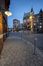 Walkway with lantern in Speicherstadt at the blue hour, Hamburg, Germany