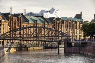 Bridge with warehouses in Hamburg's Speicherstadt, with the Elbe Philharmonic Hall in the