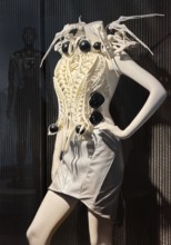 Spider-dress, eccentric, spider-like ecoskeleton as a white dress with AI and defense technology